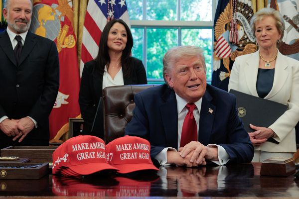 President Donald Trump speaks to the media as Secretary of Commerce Howard Lutnick, Secretary of Labor Lori Chavez-DeRemer, and Secretary of Education Linda McMahon look on after signing executive orders in the Oval Office at the White House on April 23, 2025 in Washington, D.C. (Photo by Chip Somodevilla/Getty Images)