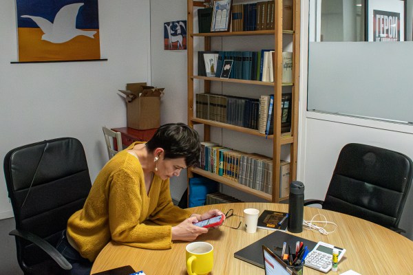 Olga Kokorina in the Russie-Liberté Association office in Paris. She also manages the evacuation of nationals across the Baltic and Caucasian borders. (Photo by Theo Prouvost)