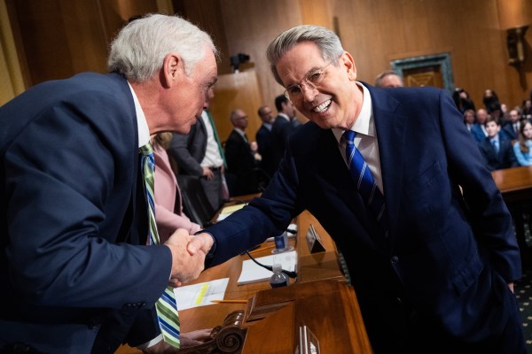 Scott Bessent greets Sen. Ron Johnson of Wisconsin before a Senate Finance Committee hearing on his nomination as Treasury secretary on January 16, 2025. (Tom Williams/CQ-Roll Call, Inc via Getty Images)