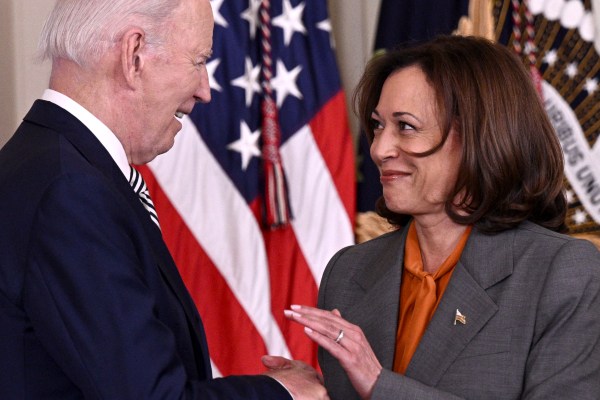 Joe Biden shakes hands with Kamala Harris prior to delivering remarks on artificial intelligence, in the East Room of the White House on October 30, 2023. (Photo by Brendan Smialowski/AFP via Getty Images)