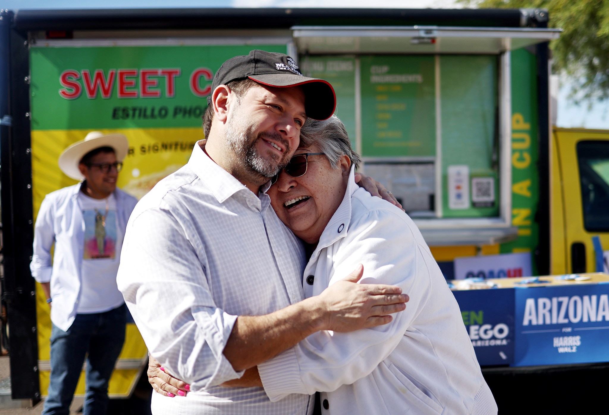 Then-Senate candidate Ruben Gallego hugs a supporter outside a polling place while greeting voters on November 5, 2024 in Guadalupe, Arizona. (Photo by Mario Tama/Getty Images)