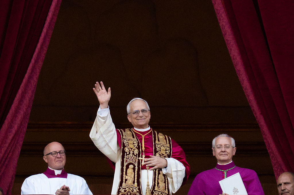 Newly elected Pope Leo XIV, Robert Prevost, arrives on the main central loggia balcony of St. Peter's Basilica for the first time after the cardinals end the conclave in The Vatican, on May 8, 2025. (Photo by Massimo Valicchia/NurPhoto via Getty Images)