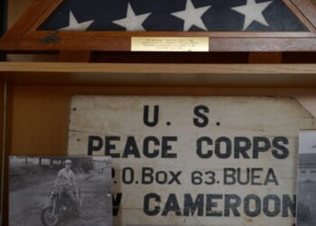 An old picture of former Ambassador Christopher Hill on a motorcycle while in the Peace Corps in Cameroon. (Photo by Helen H. Richardson/The Denver Post via Getty Images)