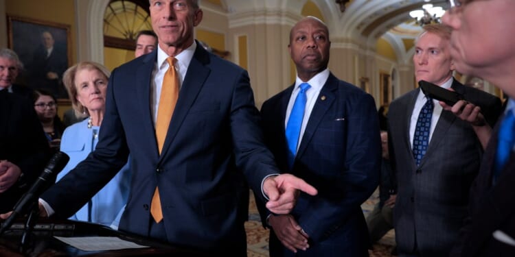 A group of men in suits
