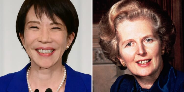 A woman smiling and a woman with a microphone