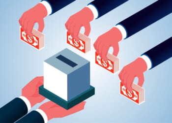 A group of hands holding money