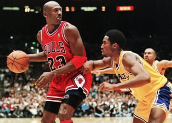 A basketball player dribbling a basketball