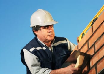 A man wearing a hard hat and vest