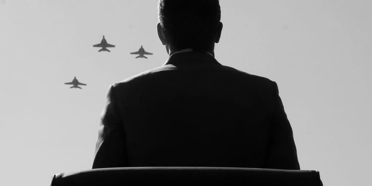 Secretary of Defense Pete Hegseth stands for a “missing man” formation flyover of the U.S. Navy VFA-106 “Gladiators” during the Department of War 2025 National Prisoner of POW/MIA Recognition Day ceremony at the Pentagon on September 19, 2025 in Arlington, Virginia. (Photo by Kevin Dietsch/Getty Images)