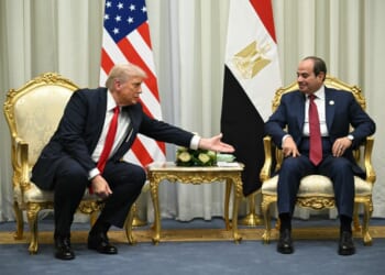 Two men sitting in chairs