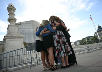 A group of women hugging
