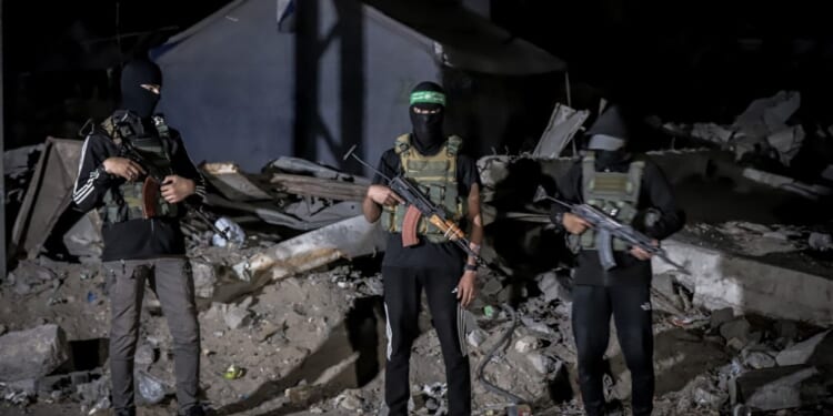 A group of people holding guns