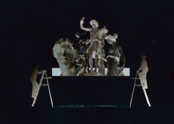 A group of statues on a ladder