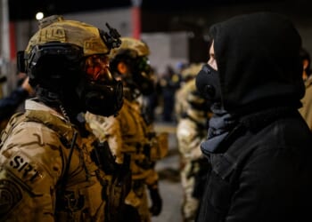A group of people wearing masks