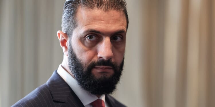 Syrian President Ahmed al-Sharaa waits to meet with France’s President Emmanuel Macron on the sidelines of the United Nations General Assembly at the UN headquarters in New York City on September 24, 2025. (Photo by LUDOVIC MARIN/POOL/AFP via Getty Images)