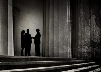A group of people standing on steps