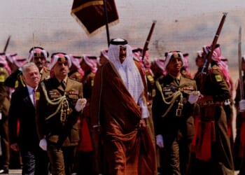 The Emir of Qatar Sheikh Tamim bin Hamad Al Thani (center) is welcomed by Jordan’s King Abdullah II (L) at Marka airport on September 17, 2025 in Amman, Jordan. (Photo by Salah Malkawi/Getty Images)