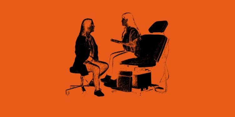 A woman sitting in a chair talking to a woman