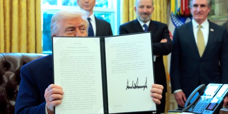 A man holding up a piece of paper