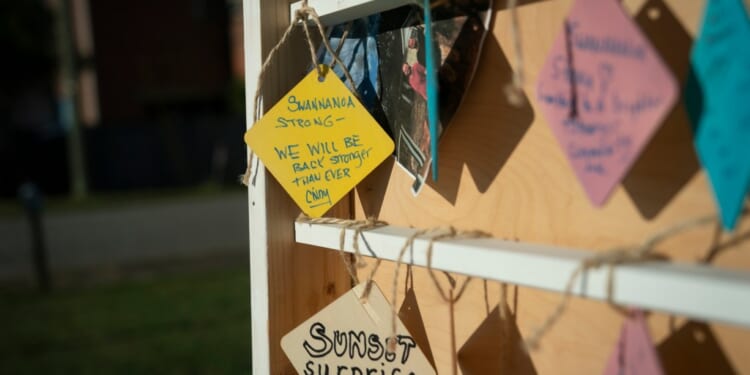A group of signs on a shelf