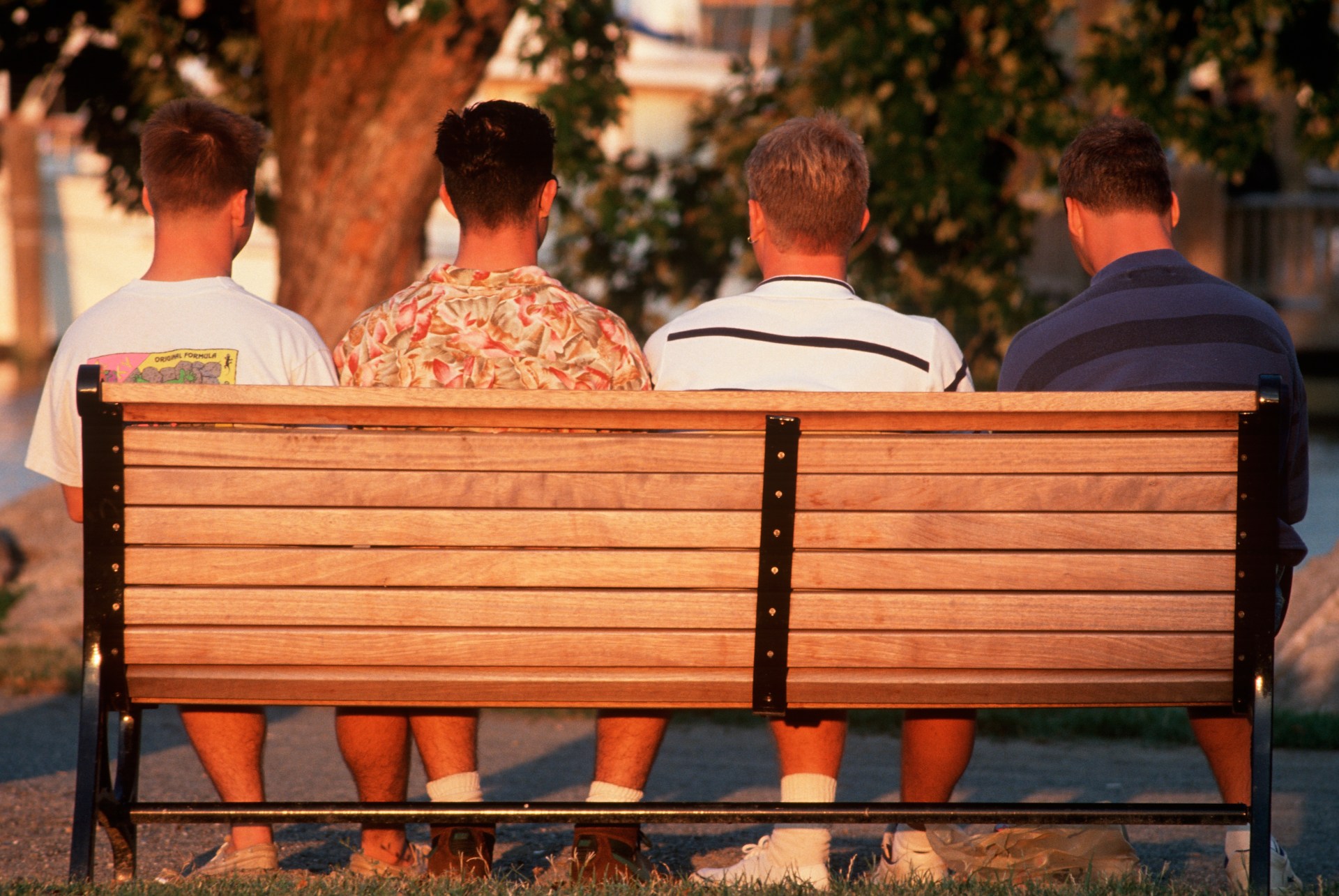 A group of men sitting on a bench
