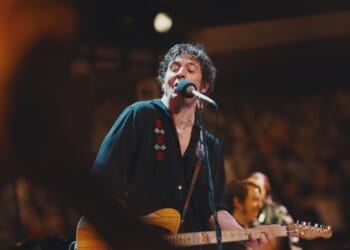 A man singing into a microphone