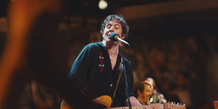 A man singing into a microphone