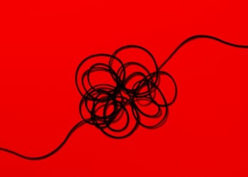 A black wire on a red background