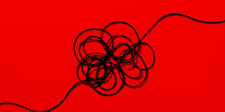 A black wire on a red background