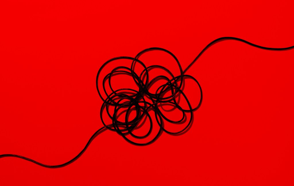 A black wire on a red background