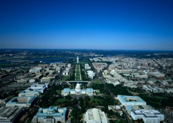 Aerial view of National Mall, with the U.S. Capitol in the foreground and Washington Monument in the