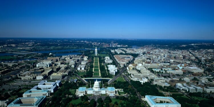Aerial view of National Mall, with the U.S. Capitol in the foreground and Washington Monument in the