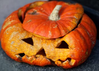 A pumpkin with carved faces