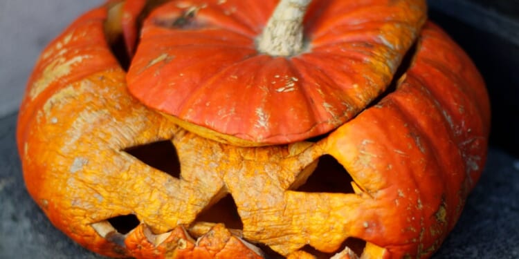 A pumpkin with carved faces