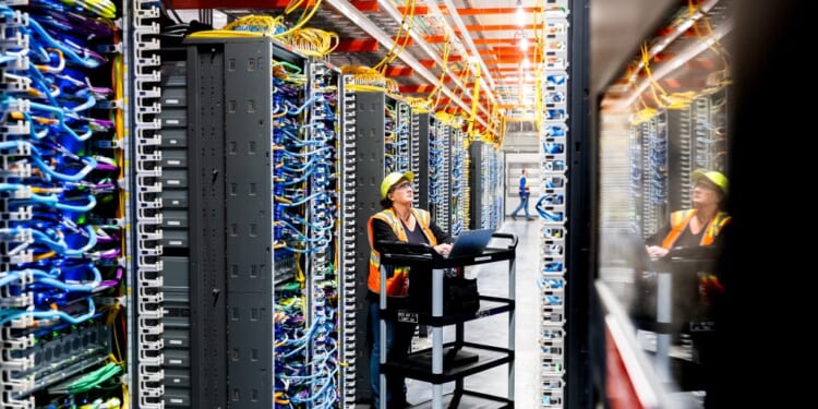 A technician works at an Amazon Web Services AI data center in New Carlisle, Indiana on October 2, 2025. (Photo by Noah Berger/Getty Images via Amazon Web Services)
