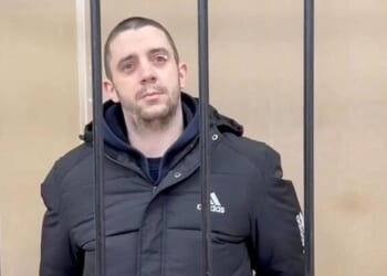 Russia Sentences UK 'Mercenary' To 13 Years In Prison Camp After Capture In Ukraine