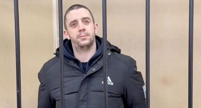 Russia Sentences UK 'Mercenary' To 13 Years In Prison Camp After Capture In Ukraine