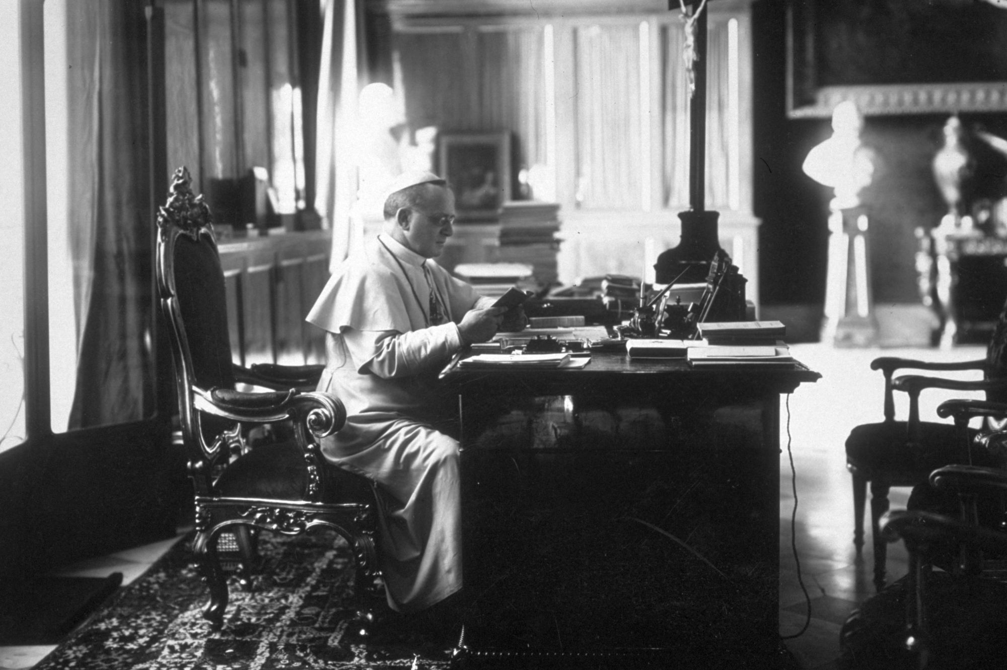 Pope Pius XI reading in his study in the Vatican. (Photo by Hulton Archive/Getty Images)