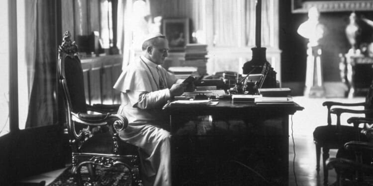 Pope Pius XI reading in his study in the Vatican. (Photo by Hulton Archive/Getty Images)