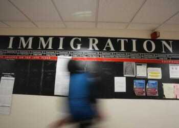 A U.S. Immigration and Customs Enforcement agent inside the Federal Plaza courthouse before making arrests on June 27, 2025 in New York. (Photo by BRYAN R. SMITH/AFP via Getty Images)