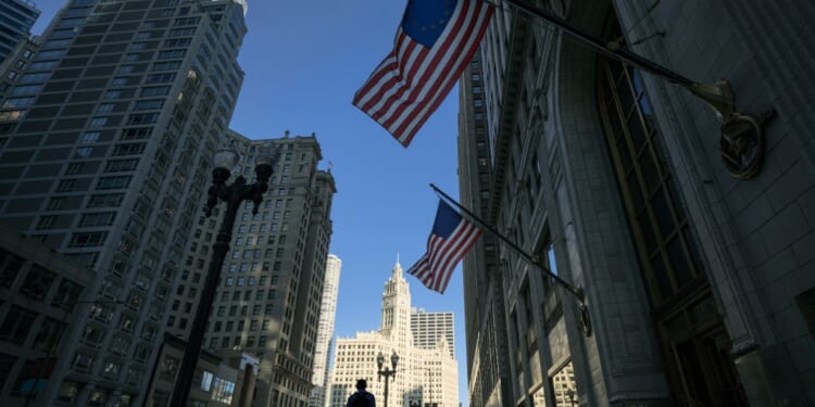 Businessman walking down North Michigan Avenue in Chicago, Illinois, USA