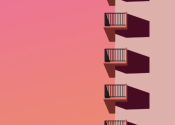 Illustration of city building with balconies and sunset gradient sky.