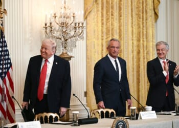 President Donald Trump,  Secretary of Health and Human Services Robert F. Kennedy Jr., and Medicare and Medicaid Administrator  Mehmet Oz, in the East Room of the White House in Washington, D.C. on January 16, 2026. (Photo by Brendan SMIALOWSKI/AFP/Getty Images)