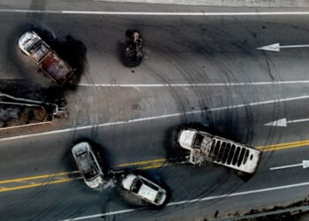 Burned cars and trucks, allegedly set on fire by drug cartel members, on a highway near Acatlan de Juarez, Jalisco state, Mexico, on February 22, 2026. (Photo by Ulises Ruiz/AFP via Getty Images)