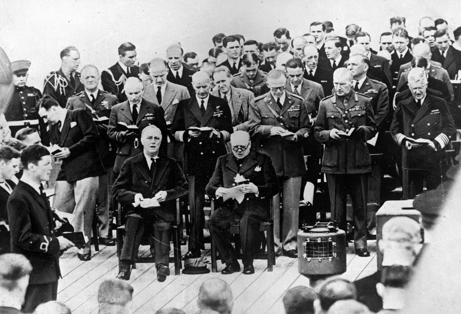 A church service during the Atlantic Conference aboard the “Prince of Wales” during which was elaborated the Atlantic Charter. Admiral King, Generals Marshal, Dill, Thomas and Admiral Stark, from left to right, with US President Franklin D Roosevelt (1882-1945) and British Prime Minister Winston Churchill (1874-1965), August 10, 1941.  (Photo by Roger Viollet via Getty Images/Roger Viollet via Getty Images)